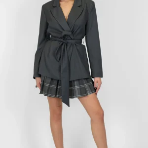 Tensione in - Minigonna fantasia check plissé con chiusura zip laterale